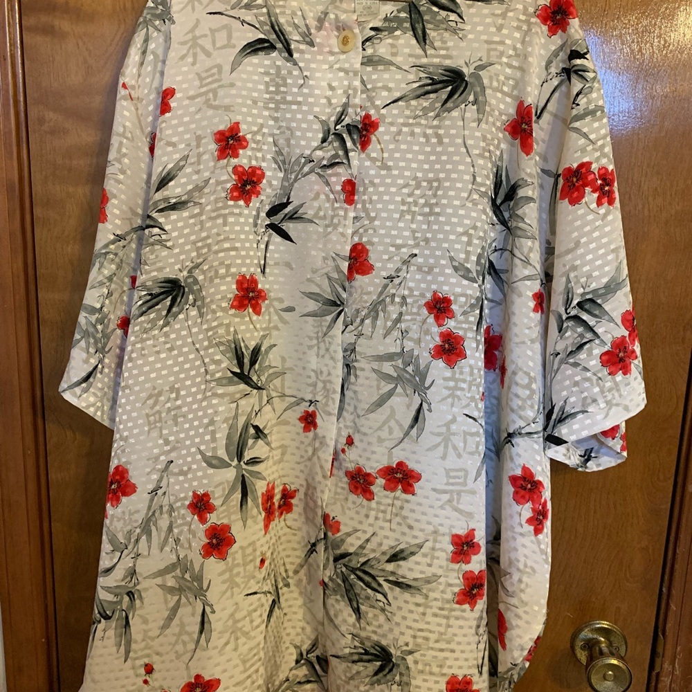 A button down blouse.  34W I believe it is a 4x.